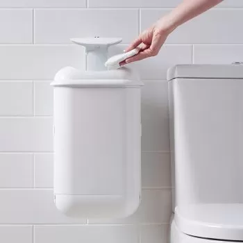 sanipod feminine waste receptacle next to toilet